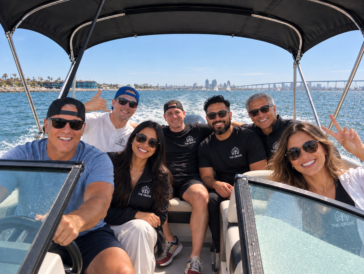 The BCGK Communities team celebrating together on a boat outing in San Diego